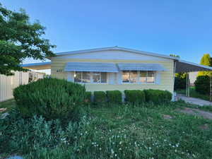 View of front of home featuring an attached carport
