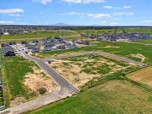 Aerial perspective of suburban area with a mountain backdrop