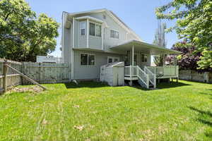 Back of property featuring a wooden deck