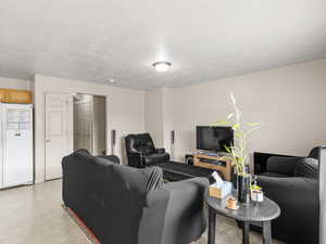 Living room featuring a textured ceiling