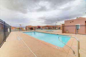 Community pool featuring a patio