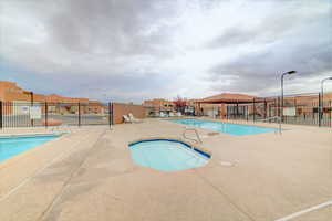 Community pool featuring a patio