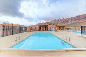 Community pool with a patio