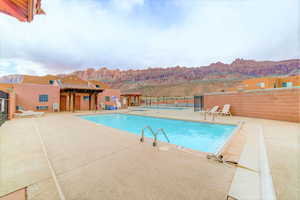 Community pool with a patio area