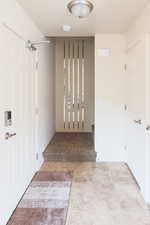 Hall with tile patterned floors