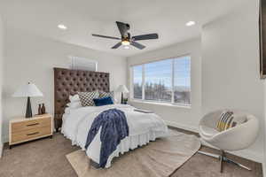 Bedroom with carpet floors, baseboards, a ceiling fan, and recessed lighting