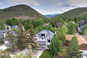 Aerial view of residential area featuring a mountain backdrop