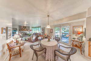Semi-formala  dining area, family room, and doors to large outdoor deck.