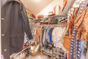 Spacious master bedroom closet.