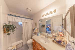 Full bath featuring shower/bath combo.
