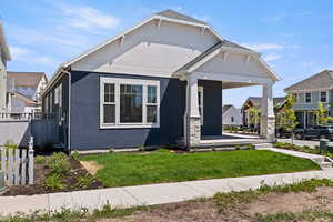 View of front of home featuring stucco siding and a porch