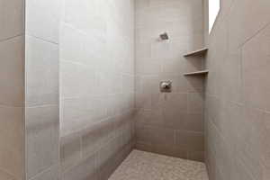 Bathroom with tiled shower