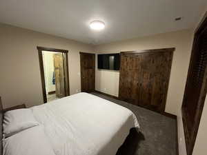 Carpeted bedroom with baseboards