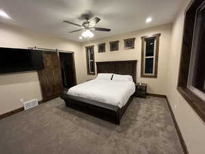 Carpeted bedroom with baseboards, recessed lighting, and ceiling fan