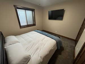 Carpeted bedroom with baseboards