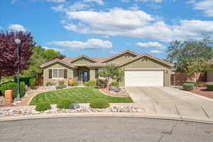 Ranch-style home featuring concrete driveway, an attached garage, and stucco siding