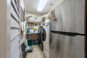 Laundry area with separate washer and dryer
