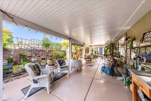 Fenced backyard featuring a patio area and outdoor dining area