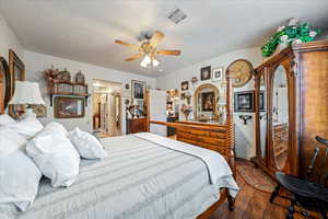Bedroom featuring hardwood / wood-style flooring and ceiling fan