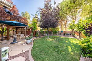 Fenced backyard featuring a patio area