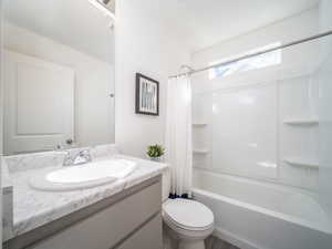 Bathroom featuring vanity and shower / tub combo