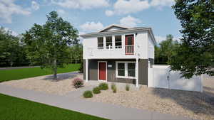 Home exterior featuring a balcony and a gate