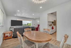 Dining area featuring light wood-style flooring and recessed lighting