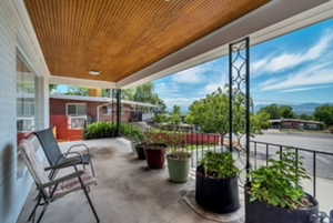 View of patio featuring a balcony