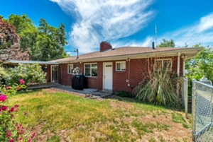 View of front of property with a chimney