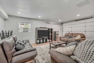 Living room featuring recessed lighting, wood finished floors, and baseboards