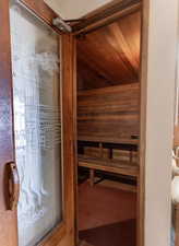 Sauna featuring wood ceiling