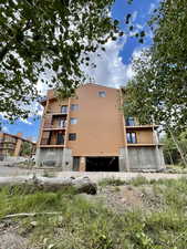 View of side of home with an attached garage