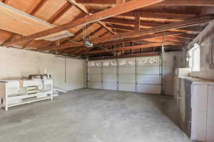 Garage featuring a garage door opener