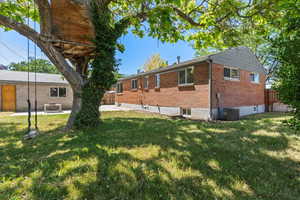 View of home's exterior featuring brick siding, a patio, and central AC unit