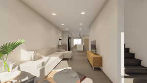 Living area with recessed lighting, light wood finished floors, and stairway