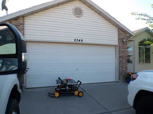Garage featuring driveway
