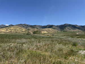View of mountain backdrop featuring rural landscape