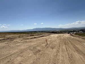 View of mountain backdrop featuring rural landscape