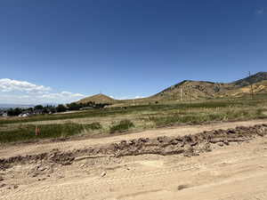 View of mountain backdrop featuring rural landscape
