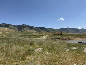 View of mountain backdrop featuring rural landscape