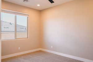Empty room featuring baseboards, carpet, and recessed lighting