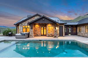 Swimming pool featuring a patio area and grilling area