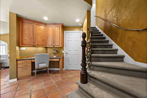 Office featuring built in study area and recessed lighting just off the kitchen and 2nd Staircase to upper level