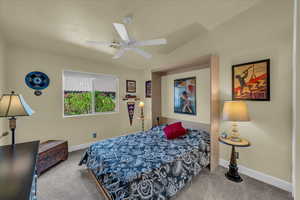 Bedroom with carpet and a ceiling fan