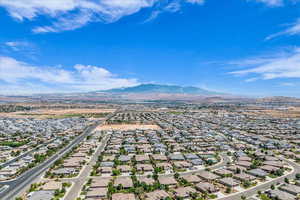 Aerial view of residential area with a mountainous background