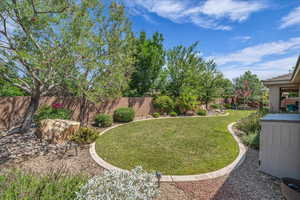 View of fenced backyard