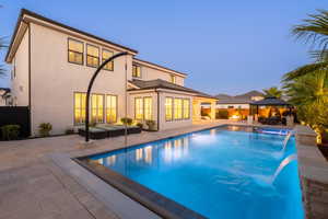 View of pool with an outdoor hangout area, a patio area, a gazebo, and a pool with connected hot tub