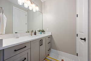 Bathroom with vanity and baseboards