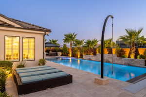 View of pool with outdoor lounge area, a patio area, a fenced backyard, and a gazebo