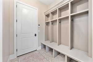 Mudroom featuring baseboards